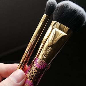 Two tarte makeup brushes.